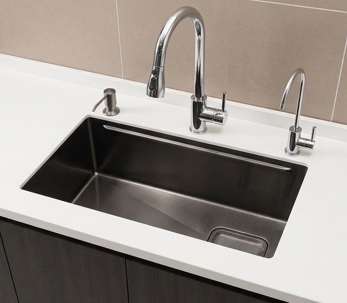 Undermount stainless steel kitchen sink fixed below the countertop